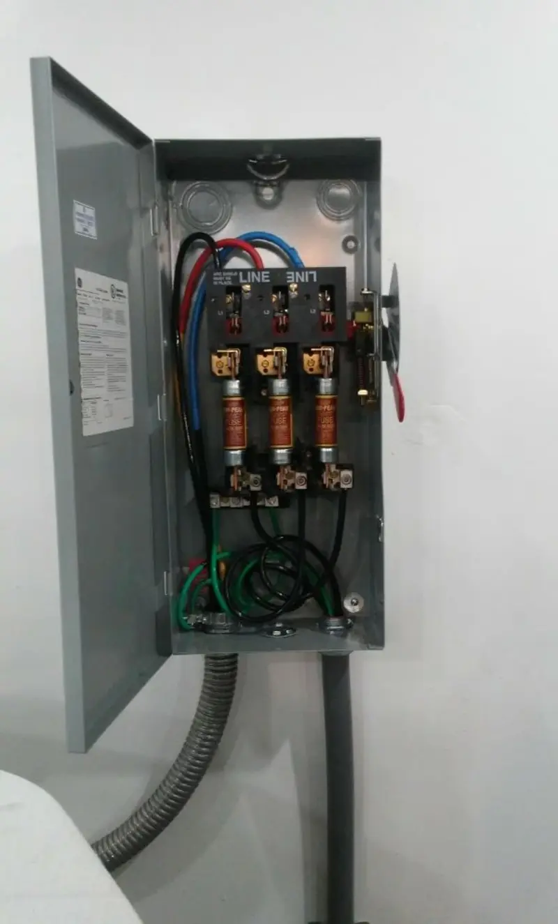 Three-phase disconnect switch installed for Smoke Detector Installation in Huntington
